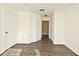 Bedroom with double door closets and wood floors at 5467 Vineland Rd # 6308, Orlando, FL 32811