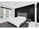Bright bedroom with city views and modern bed at 241 Riverside Dr # 1901, Daytona Beach, FL 32117