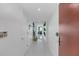 Bright condo entryway with tile floors and modern door at 241 Riverside Dr # 1901, Daytona Beach, FL 32117