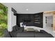 Living room features a dark accent wall and a lush green wall at 241 Riverside Dr # 1901, Daytona Beach, FL 32117
