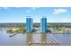 Aerial view of two waterfront condo towers with pools and boat docks at 241 Riverside Dr # 1901, Daytona Beach, FL 32117