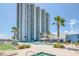 Luxury condo complex featuring a resort-style pool and hot tub at 241 Riverside Dr # 1901, Daytona Beach, FL 32117