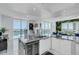 Spacious kitchen featuring granite island and water views at 241 Riverside Dr # 1901, Daytona Beach, FL 32117