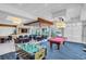 Spacious recreation room with pool table, foosball, and lounge area at 241 Riverside Dr # 1901, Daytona Beach, FL 32117