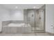 Bathroom with soaking tub and walk-in shower at 241 Riverside Dr # 1901, Daytona Beach, FL 32117