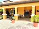 Relaxing outdoor space with seating, games, and vending machines at 5467 Vineland Rd # 6308, Orlando, FL 32811