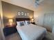 King bedroom with ceiling fan and decorative wall art at 8959 Shine Dr, Kissimmee, FL 34747