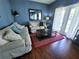 Cozy living room featuring comfortable seating and access to patio at 8959 Shine Dr, Kissimmee, FL 34747