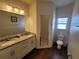 Bathroom with double vanity and walk-in shower at 8959 Shine Dr, Kissimmee, FL 34747