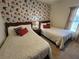 Bedroom with two twin beds and Marvel themed decor at 8959 Shine Dr, Kissimmee, FL 34747