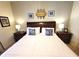 King bedroom with tropical theme and nightstands at 8959 Shine Dr, Kissimmee, FL 34747