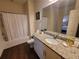 Clean bathroom with granite countertop vanity and shower/tub combo at 8959 Shine Dr, Kissimmee, FL 34747