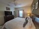 King bedroom with TV and dresser at 8959 Shine Dr, Kissimmee, FL 34747