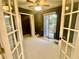 Bedroom with balcony access and neutral carpeting at 936 Birmingham Ct # 200, Lake Mary, FL 32746