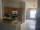 Kitchen with wood cabinets, stainless steel appliances, and tile floor at 4336 Cypress Bay Ct, Orlando, FL 32822