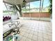 Spacious screened porch with tile flooring, overlooks backyard at 4336 Cypress Bay Ct, Orlando, FL 32822