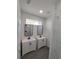 Bathroom with double vanity and marble shower at 609 Amazon Pl, Kissimmee, FL 34759