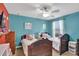 Bedroom with twin beds and teal colored walls at 1383 Alston Bay Blvd, Apopka, FL 32703
