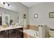 Bathroom with double vanity, garden tub, and tile flooring at 1383 Alston Bay Blvd, Apopka, FL 32703