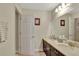 Bathroom with double vanity and access to another room at 1383 Alston Bay Blvd, Apopka, FL 32703