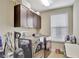 Laundry room with washer, dryer, and overhead cabinets at 1383 Alston Bay Blvd, Apopka, FL 32703