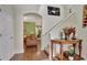 Entryway with hardwood floors, a staircase, and a view of the living room at 1383 Alston Bay Blvd, Apopka, FL 32703