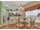 Bright kitchen with white cabinets, stainless steel appliances, and a breakfast nook at 1383 Alston Bay Blvd, Apopka, FL 32703