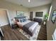 Spacious main bedroom with a large bed and a modern dresser at 2827 Sw 146Th Place Rd, Ocala, FL 34473