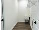 Laundry room with utility sink and shelving at 2827 Sw 146Th Place Rd, Ocala, FL 34473