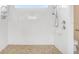 Large walk-in shower with grab bars and tiled flooring at 4080 Oaktree Dr, Davenport, FL 33837