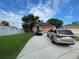 House with two cars parked in driveway at 4336 Cypress Bay Ct, Orlando, FL 32822