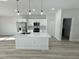 Modern kitchen with stainless steel appliances and white cabinets at 13053 Sw 36Th Ct, Ocala, FL 34473