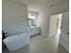 Large bathroom with double sinks, modern cabinets, and a free-standing tub at 13053 Sw 36Th Ct, Ocala, FL 34473