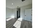 Spacious bedroom with hardwood floors and an adjacent hallway at 13053 Sw 36Th Ct, Ocala, FL 34473