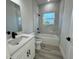 Clean bathroom with a bathtub, shower, and modern vanity at 13053 Sw 36Th Ct, Ocala, FL 34473