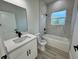 Clean bathroom with a bathtub, shower, and modern vanity at 13053 Sw 36Th Ct, Ocala, FL 34473
