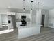 Modern kitchen with stainless steel appliances and white cabinets at 13053 Sw 36Th Ct, Ocala, FL 34473