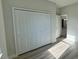 Bright bedroom with a spacious closet and light-colored wood flooring at 13053 Sw 36Th Ct, Ocala, FL 34473