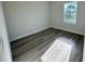 Simple bedroom with wood-look floors and a window at 13053 Sw 36Th Ct, Ocala, FL 34473