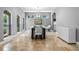 Bright dining room features a large table, chandelier, and plenty of natural light at 1451 Lyndale Blvd, Winter Park, FL 32789