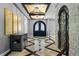 Elegant entryway with double doors, stone wall, and unique flooring at 1451 Lyndale Blvd, Winter Park, FL 32789