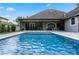 Sparkling blue pool with spacious patio and covered lanai at 1451 Lyndale Blvd, Winter Park, FL 32789