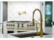 Modern kitchen sink with a gold finish faucet at 1451 Lyndale Blvd, Winter Park, FL 32789