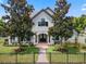 Two-story house with a double front door and landscaped yard at 1451 Lyndale Blvd, Winter Park, FL 32789