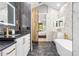 Elegant bathroom with a soaking tub and chevron tile at 1451 Lyndale Blvd, Winter Park, FL 32789