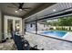 Screened-in lanai with a refreshing pool and patio seating at 1451 Lyndale Blvd, Winter Park, FL 32789