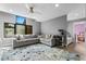 Spacious living area featuring a comfortable sectional sofa and large windows at 1451 Lyndale Blvd, Winter Park, FL 32789