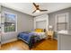 Cozy bedroom with a built-in murphy bed, hardwood floors, and ample natural light at 1451 Lyndale Blvd, Winter Park, FL 32789