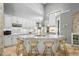 Modern kitchen with white cabinets, large island, and high-end appliances at 1451 Lyndale Blvd, Winter Park, FL 32789