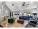 Comfortable living room with leather sofas, large windows, and high ceilings at 1451 Lyndale Blvd, Winter Park, FL 32789